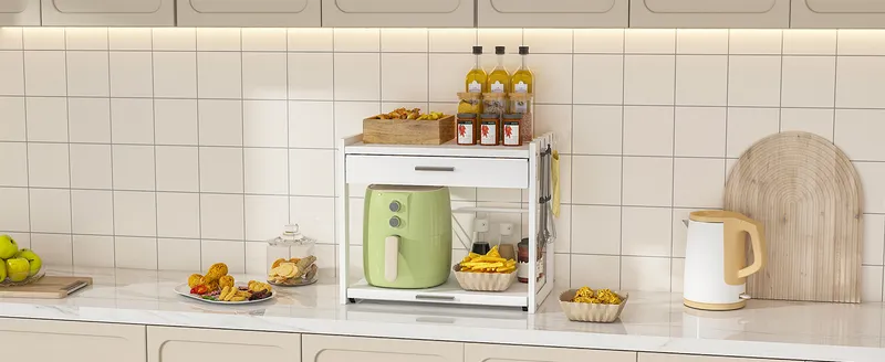White microwave stand with an air fryer in a tiled kitchen