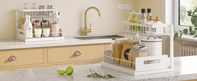 White L-shaped organizer with spices and oils on a kitchen counter